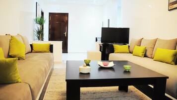 Apartment, 2 Bedrooms | Living room | 43-inch LCD TV with satellite channels, TV