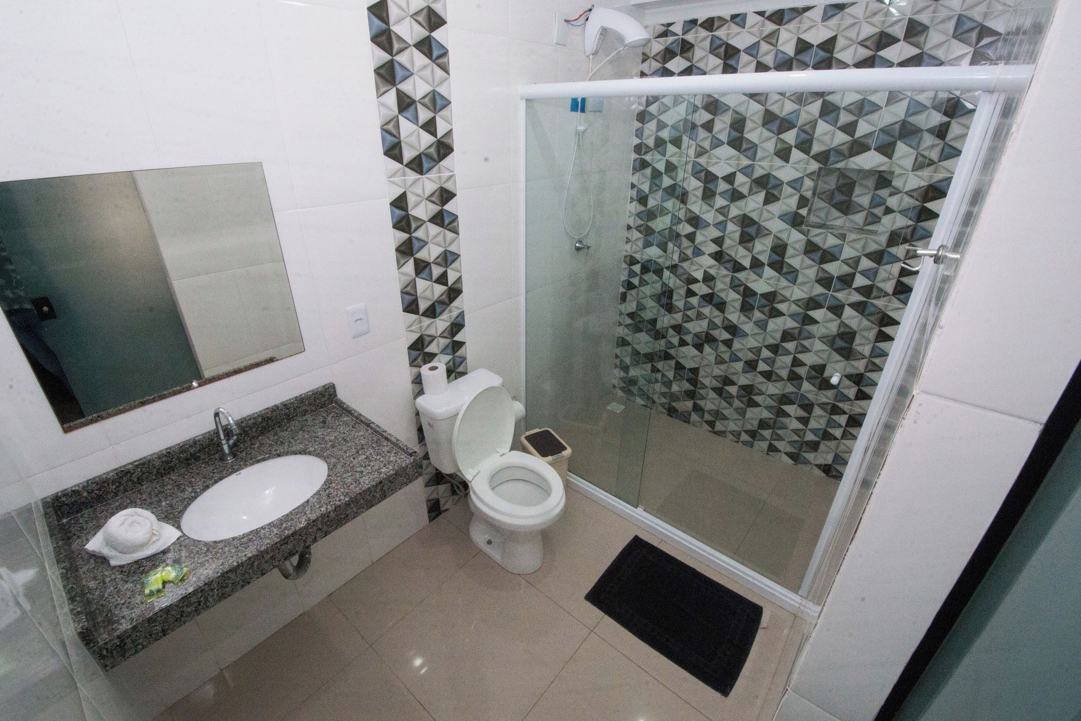 standard double room | bathroom | shower, hair dryer, towels