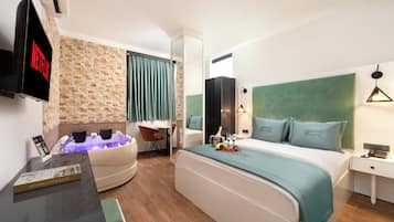 Premium bedding, down duvets, free minibar items, in-room safe