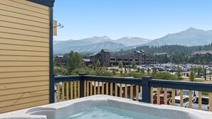 A hot tub on a balcony with a view of mountains and a parking lot. - Downtown Location - Steps to Gondola, Hot Tub, DOG FRIENDLY SCC3 (Breckenridge)