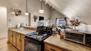 A modern kitchen with a large island, built-in oven, microwave, and various appliances. - Downtown Location - Steps to Gondola, Hot Tub, DOG FRIENDLY SCC3 (Breckenridge)
