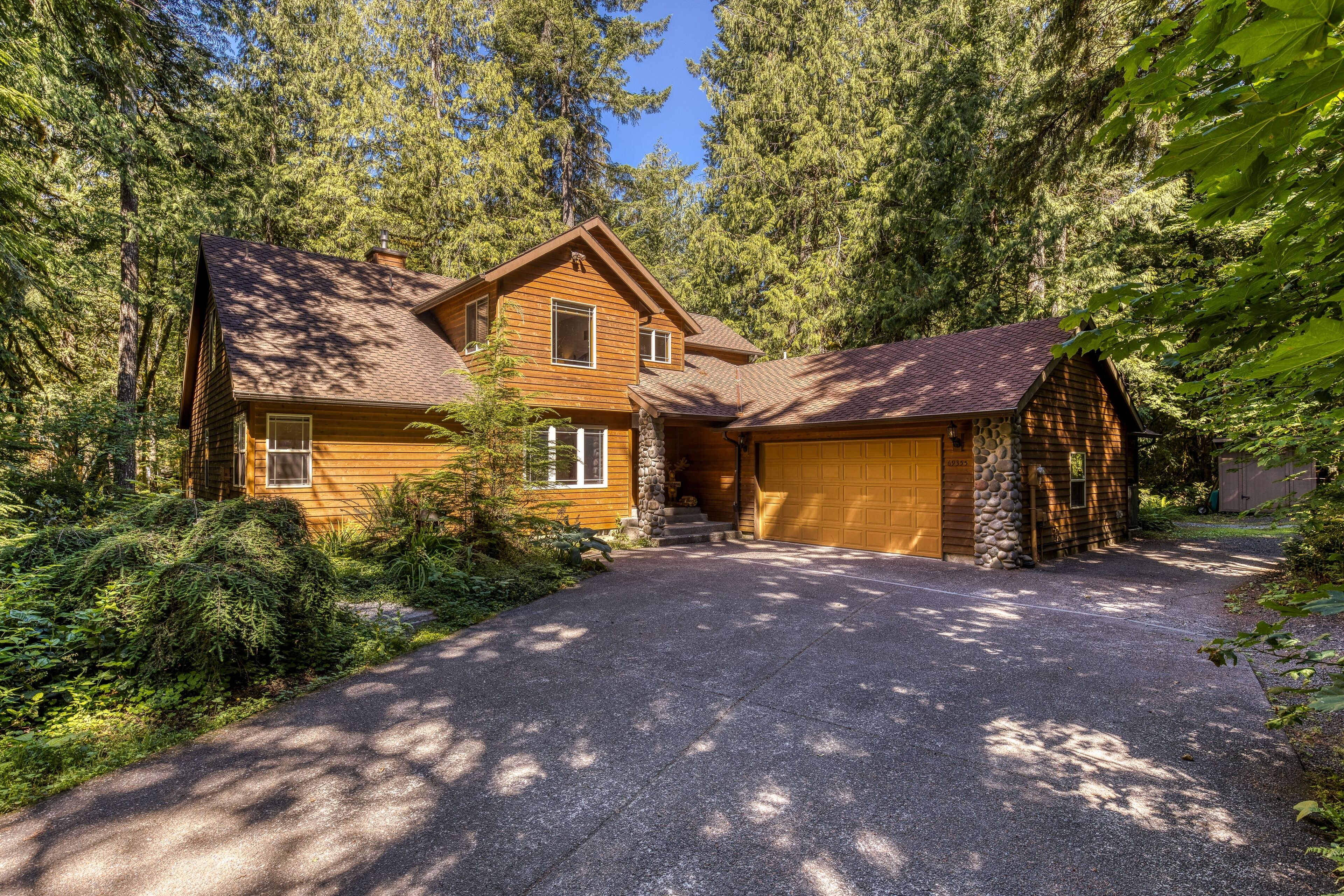 Classic riverfront home w/ great views, game room, hot tub, & modern cabin feel