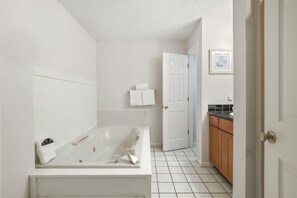 Shower, jetted tub, hair dryer, towels