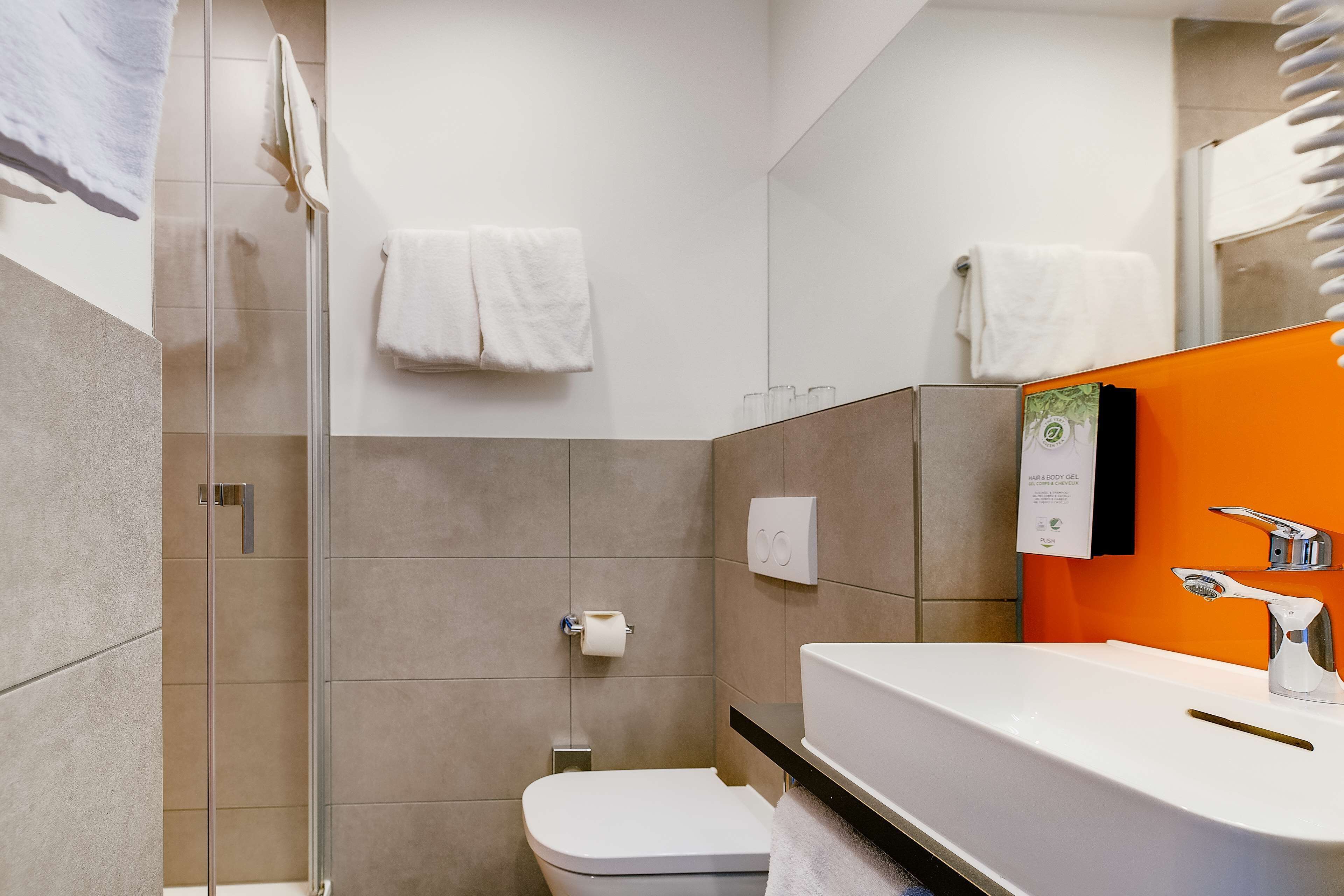 shower, eco-friendly toiletries, hair dryer, towels
