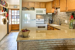 Fridge, microwave, stovetop, coffee/tea maker