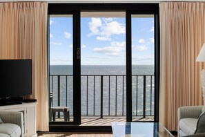 Enjoy breathtaking views of the water from the balcony with a metal railing.
