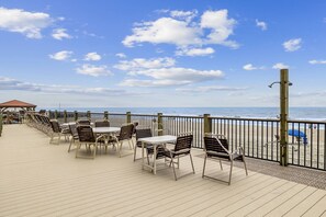 A deck with tables and chairs overlooking the ocean. - *Fall into Savings-20% Off New Bookings thru 2026* (Garden City)
