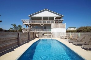 A two-story house with a pool, wooden deck, and outdoor furniture. - SN8608- Semi-OF! 4 BRs, Great Views, Private Pool & Basketball! (Nags Head)