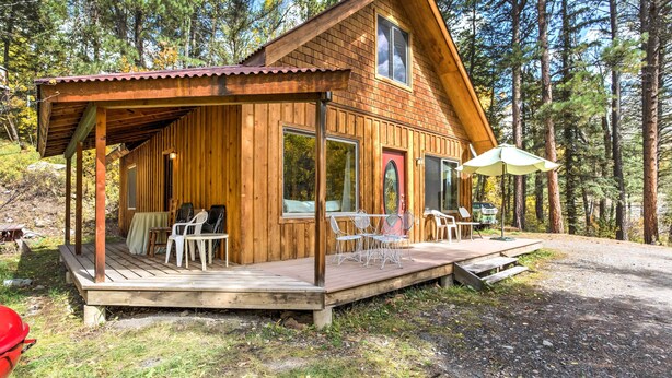 A wooden cabin with a porch, outdoor seating, and a covered patio area. - 'Marble Hideaway' Cabin w/ Mountain Views + Deck! (Marble)