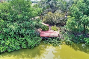 You'll love lounging on the private deck overlooking the neighboring pond.