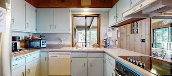 Unique lakefront cabin near the dunes with a private dock & fireplace