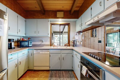 Unique lakefront cabin near the dunes with a private dock & fireplace