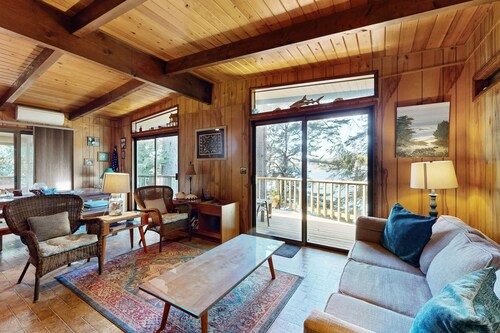 Unique lakefront cabin near the dunes with a private dock & fireplace