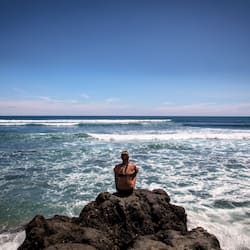 Beach nearby, black sand, sun loungers, beach umbrellas