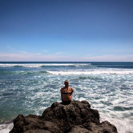 Beach nearby, black sand, sun loungers, beach umbrellas