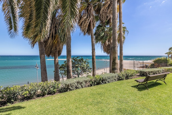 On the beach, sun loungers, beach towels