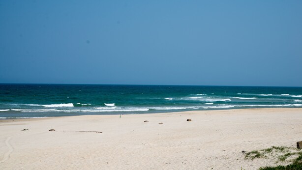 A beach with a clear sky and calm sea. - 3BR bedroom house near the beach and golf course  (Da Nang)