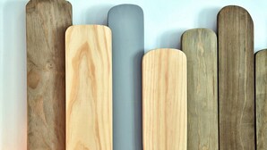 A row of wooden planks in various shades of brown and gray.