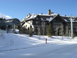 A large, multi-story hotel with a ski resort backdrop. - Luxurious Crystal Peak Lodge, 2 BR/2 BA, Ski-in/Ski-Out (Breckenridge)