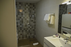 Shower, hair dryer, towels, soap