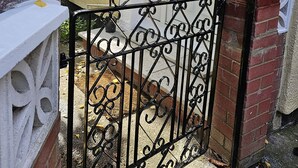 A white door with a small window above it, a black wrought iron gate, and a brick wall. - Orchard in Orpington (St Paul's Cray, Orpington) (Orpington)