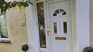 A white door with a small window, a mailbox, and a number plate '61'. - Orchard in Orpington (St Paul's Cray, Orpington) (Orpington)