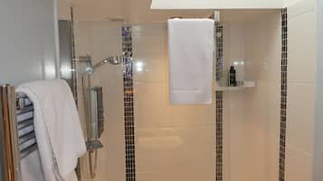 Shower, hair dryer, towels, soap