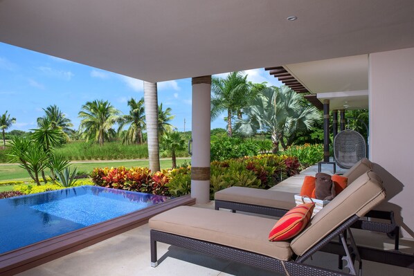 A heated pool, sun loungers