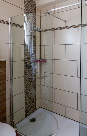 Bathtub, hair dryer, towels, soap