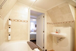 Combined shower/tub, hair dryer, towels, soap