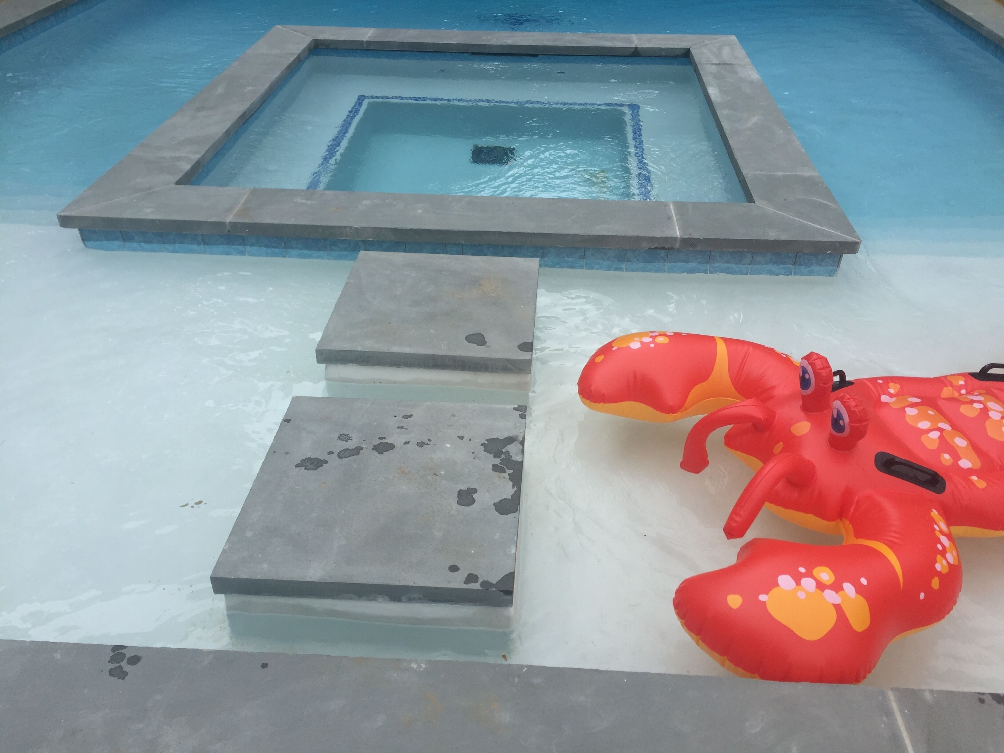 Outdoor pool, a heated pool, pool umbrellas