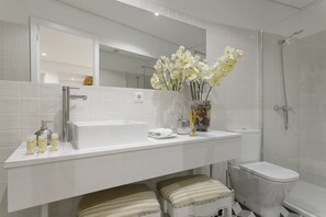 Shower, hair dryer, towels, soap