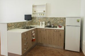 Fridge, stovetop, electric kettle, toaster