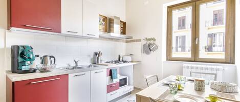 Fridge, microwave, stovetop, coffee/tea maker