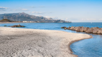 On the beach, sun-loungers