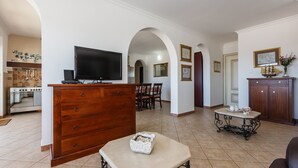 A spacious living area with a kitchen, a dining area, and a seating space. -  Idyllic Villa near Split, pool, garden, free parking and stunning view, (OWNER) (Solin)