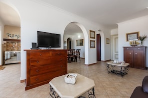 A spacious living area with a kitchen, a dining area, and a seating space. -  Idyllic Villa near Split, pool, garden, free parking and stunning view, (OWNER) (Solin)