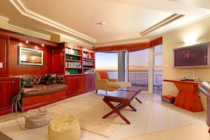 Smart TV, fireplace, books, printers