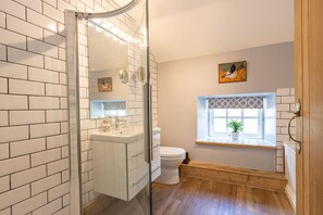 Bathtub, hair dryer, towels, soap