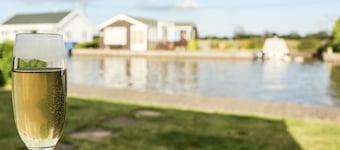 Well-appointed, spacious 3 bedroom riverside cabin in tranquil Norfolk Broads.