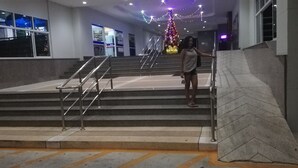 A staircase with metal railings leading to a higher floor.