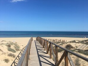 On the beach, sun-loungers, beach towels