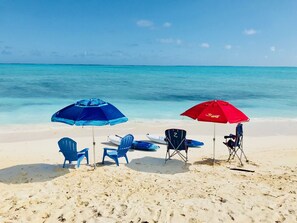 On the beach, sun-loungers
