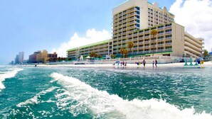 A beachfront hotel with multiple balconies, a pool area, and a view of the ocean. - Ocean Views | Pool | 8th Floor 1BR | Sleeps 6 | Free Daily Activities (Daytona Beach)