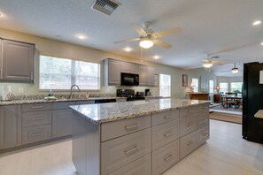 Enjoy meals in the spacious kitchen with a large island and integrated appliances.