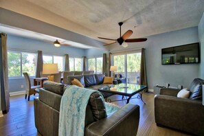 TV, books - 5BR Island Home - Private Pool, Game Room & Golf Cart - Steps to Beach (North Captiva)