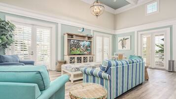 Télévision, cheminée, lecteur de DVD, baby-foot