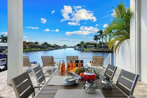 Outdoor dining - Modern Waterfront Home: Heated Pool, Spa & Dock (Cape Coral)