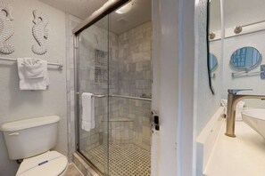 Shower, hair dryer, towels, shampoo