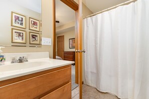 Bathtub, jetted tub, hair dryer, towels